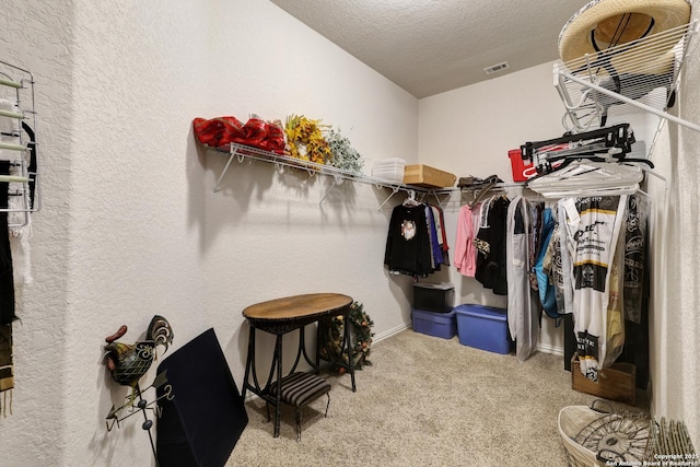 walk in closet with carpet flooring and visible vents