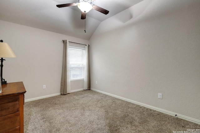 unfurnished room featuring baseboards, light carpet, a ceiling fan, and lofted ceiling