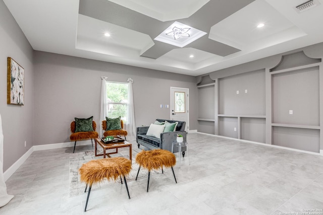 living area featuring recessed lighting, built in shelves, a tray ceiling, visible vents, and baseboards