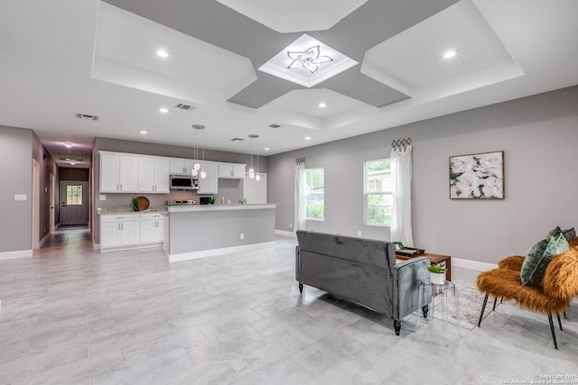 living room featuring coffered ceiling, recessed lighting, visible vents, and baseboards