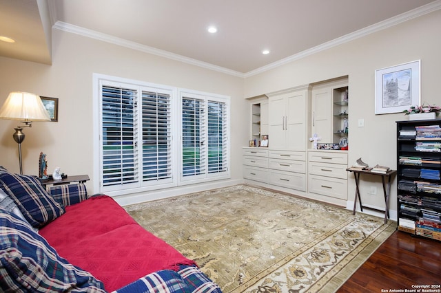 living area with crown molding, recessed lighting, and wood finished floors