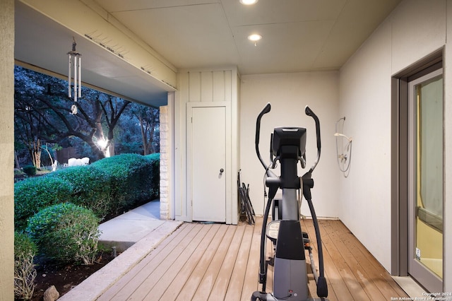 exercise room featuring light wood-style floors and recessed lighting