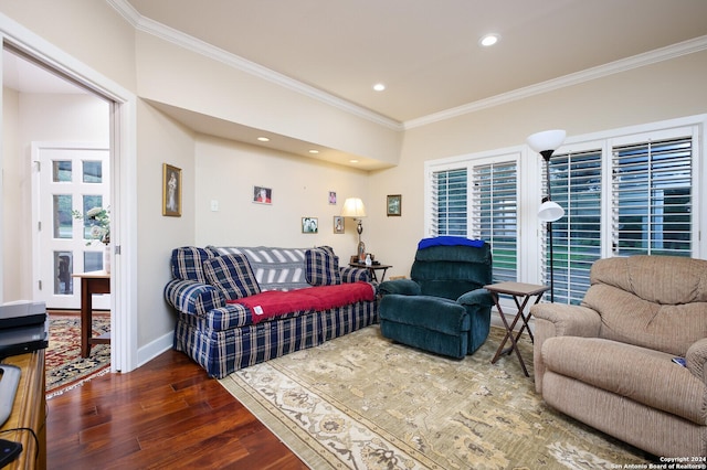 living area with crown molding, baseboards, recessed lighting, and wood finished floors