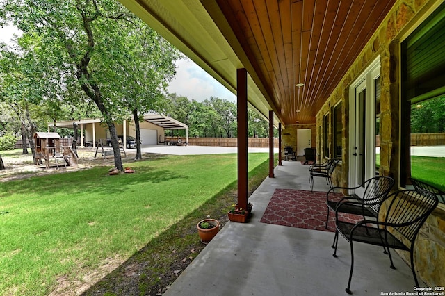 view of yard featuring fence and a patio