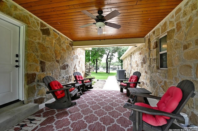 view of patio with a ceiling fan and central AC