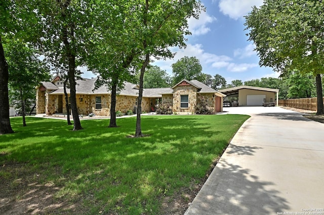 single story home featuring fence, driveway, a front lawn, and stone siding