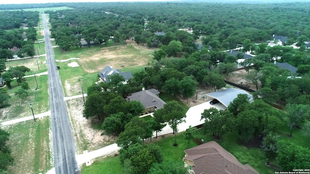 drone / aerial view with a view of trees