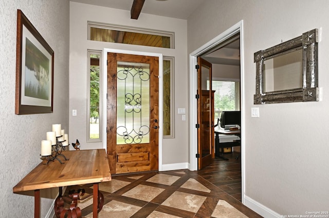 entryway featuring baseboards