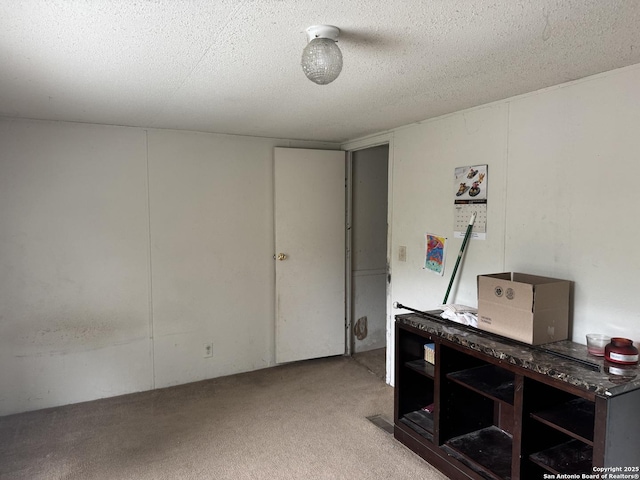 interior space with a textured ceiling