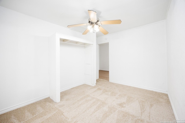 unfurnished bedroom with baseboards, ceiling fan, and carpet