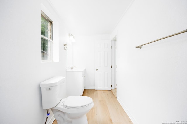 bathroom with toilet and wood finished floors