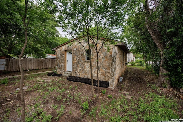 view of outdoor structure featuring fence