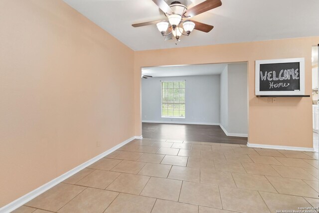 189 National, Universal City, TX 78148 - spare room featuring a ceiling fan, baseboards, and light tile patterned flooring