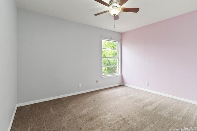 empty room featuring baseboards, carpet, and a ceiling fan
