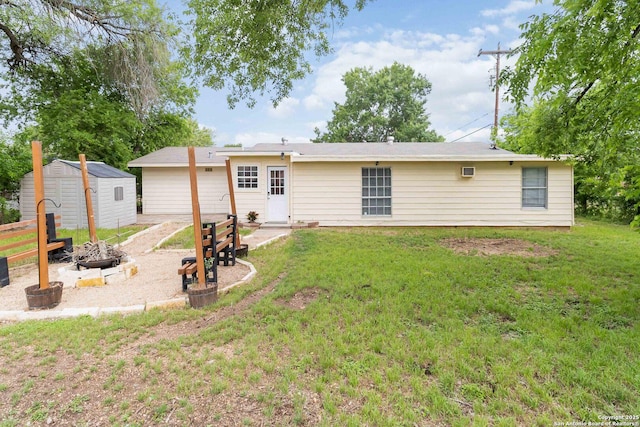 189 National, Universal City, TX 78148 - rear view of house featuring a storage shed, a patio, a lawn, and an outdoor fire pit
