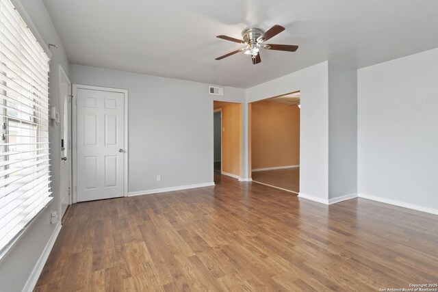 189 National, Universal City, TX 78148 - empty room with a ceiling fan, baseboards, visible vents, and wood finished floors