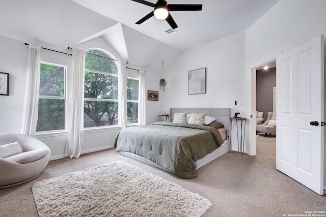 carpeted bedroom featuring a ceiling fan, baseboards, visible vents, and lofted ceiling