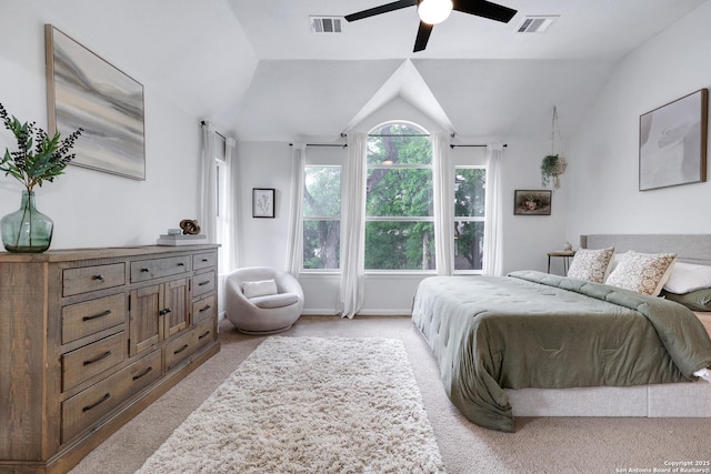 carpeted bedroom with a ceiling fan, vaulted ceiling, and visible vents