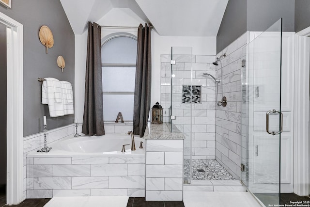 bathroom with a garden tub and a stall shower