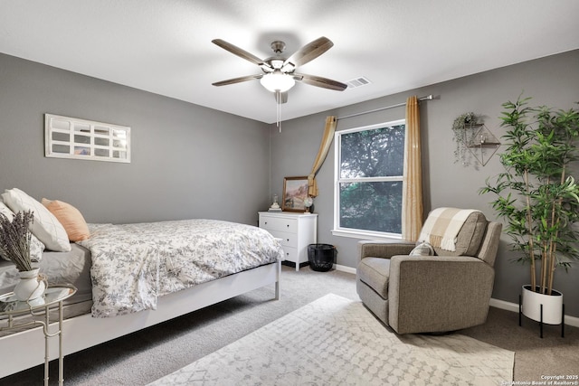 bedroom with baseboards, visible vents, light carpet, and ceiling fan