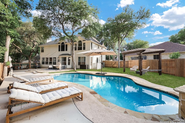 view of swimming pool featuring a fenced in pool, a pergola, a fenced backyard, and a patio