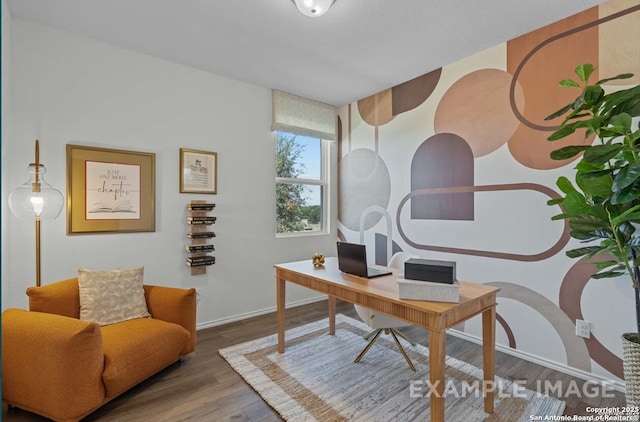 office space with baseboards and wood finished floors