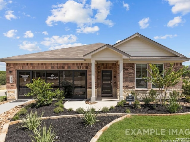 view of front of house with brick siding