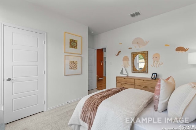 bedroom featuring visible vents, baseboards, and light colored carpet