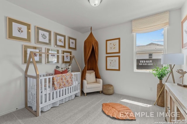 bedroom with carpet and a crib