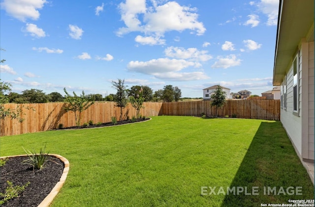 view of yard featuring a fenced backyard