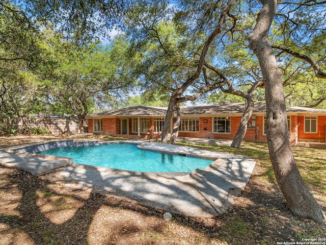 view of pool featuring a fenced in pool, fence, and a patio area