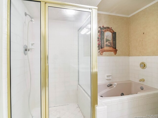 full bathroom featuring crown molding, a whirlpool tub, and a stall shower
