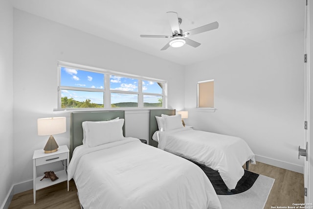 1880 Trail Pass Dr, Canyon Lake, TX 78133 - bedroom featuring baseboards, ceiling fan, and light wood finished floors