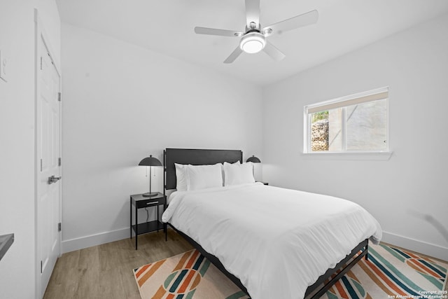 1880 Trail Pass Dr, Canyon Lake, TX 78133 - bedroom featuring baseboards, a ceiling fan, and wood finished floors