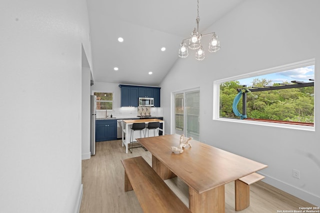 1880 Trail Pass Dr, Canyon Lake, TX 78133 - dining space with light wood-type flooring, recessed lighting, a notable chandelier, and a wealth of natural light