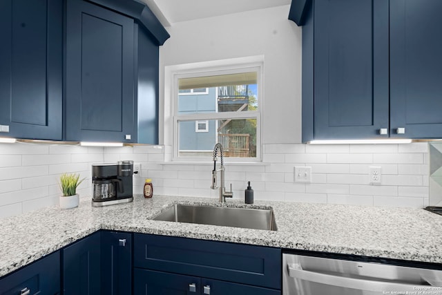 1880 Trail Pass Dr, Canyon Lake, TX 78133 - kitchen featuring stainless steel dishwasher, a sink, backsplash, and blue cabinetry