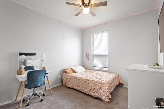 carpeted bedroom with baseboards and ceiling fan