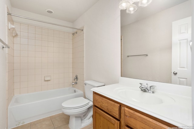 bathroom with toilet, tile patterned floors, shower / bath combination, and vanity