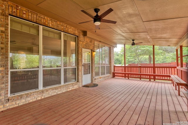 wooden deck with fence and a ceiling fan