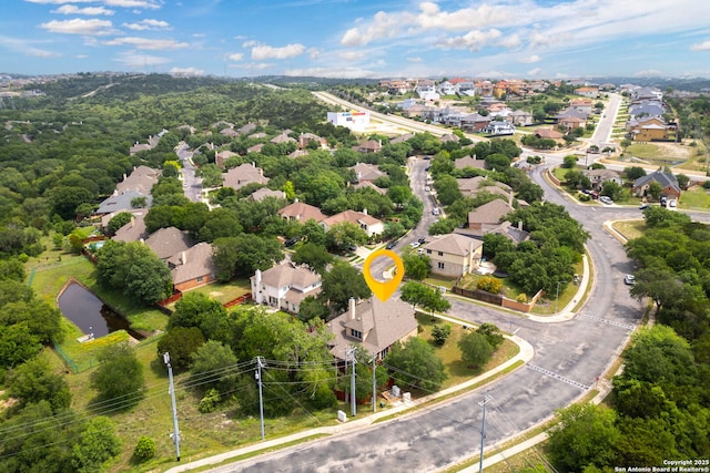 birds eye view of property with a residential view