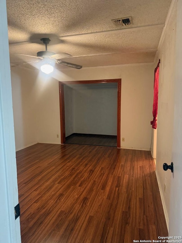 1074 Honeytree St, San Antonio, TX 78245 - empty room featuring a ceiling fan, a textured ceiling, visible vents, and wood finished floors