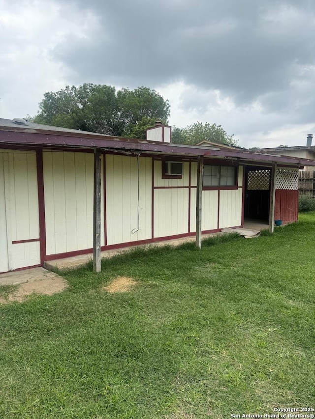 1074 Honeytree St, San Antonio, TX 78245 - rear view of property featuring a lawn