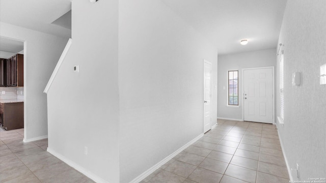 7350 Braes Cor, San Antonio, TX 78244 - hallway with light tile patterned floors and baseboards