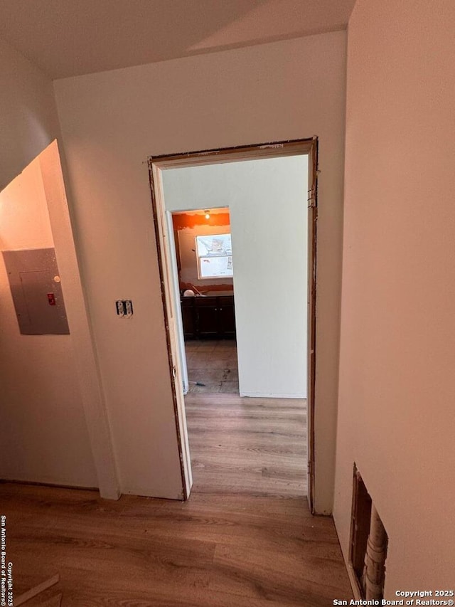 corridor with wood finished floors