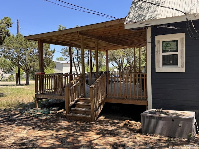 wooden terrace featuring cooling unit
