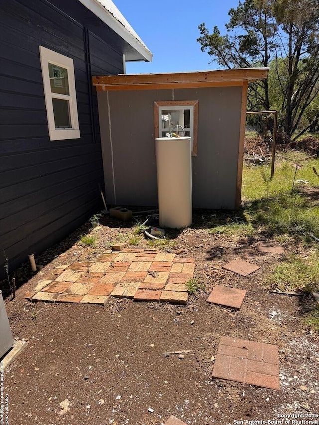 exterior space with an outbuilding and a storage unit