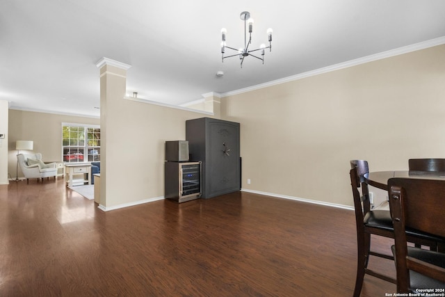 dining area featuring baseboards, ornamental molding, and wood finished floors