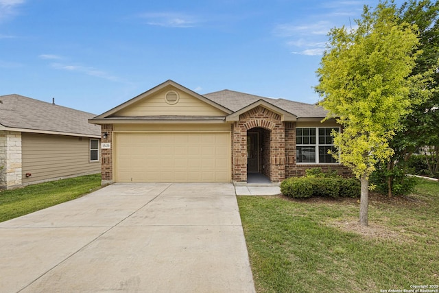 ranch-style house featuring brick siding, an attached garage, driveway, and a front lawn