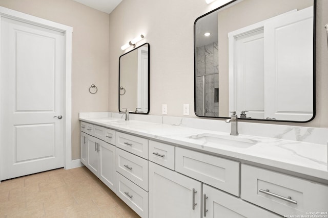 bathroom featuring double vanity and a sink