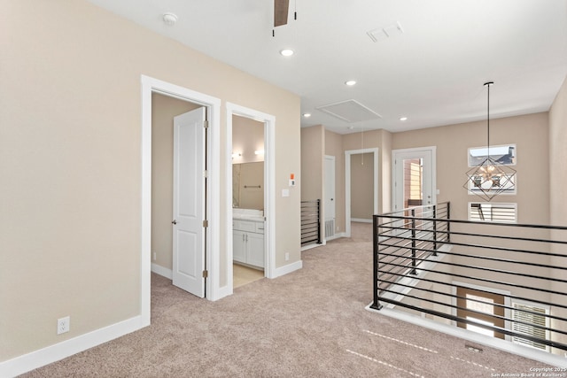 interior space with a ceiling fan, attic access, visible vents, baseboards, and recessed lighting